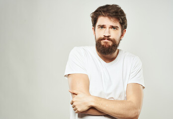 Fototapeta premium The guy gestures with his hands a puzzled look of emotion of bewilderment