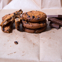 Cookies with chocolate icing, on gray packaging paper, copy space, template