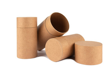 Different recyclable paper tubes, cardboard containers with paper caps for cosmetic or other packaging isolated on white background, mockup. Eco-friendly packaging concept. Selective focus