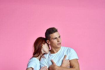 Obraz premium young couple family parents pink background hug