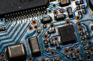 Close-up printed circuit board with electronics components. Macro photography for electric...