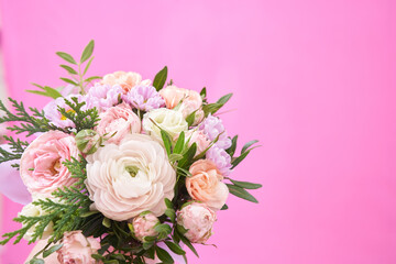 Beautiful bouquet of mixed different flowers on pink background, greeting, gift