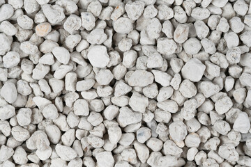 White pebbles background texture. Rock background. clay pebbles