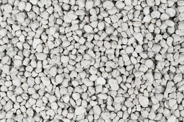 White pebbles background texture. Rock background. clay pebbles