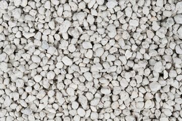 White pebbles background texture. Rock background. clay pebbles