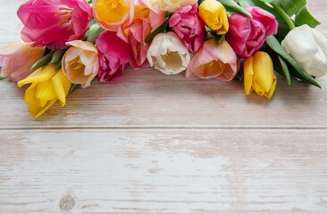 Spring tulips on a wooden background