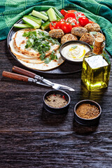 lamb meatballs with veggies and hummus, top view