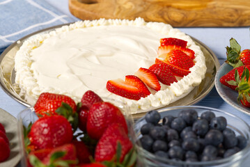 Homemade strawberries cake made from meringue cake and cream with strawberries. home cooking concept