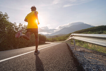 man runner athlete on the road to healthy, Young people running exercise on street.