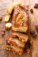 banana bread with ingredient on wood background