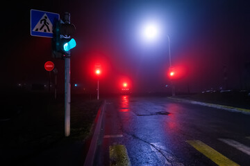 Night road in the city, cloudy weather, traffic lights, pedestrian crossing, fog (soft focus, bokeh)