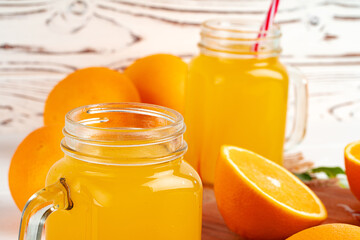 Close up of orange juice glass on wooden table