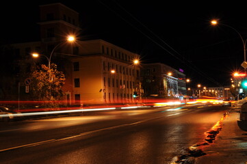 Murmansk, Russia-September 2010: Light traces of a passing trolleybus. Artistic image. Long exposure photo taken in the city. Night lights of the city, night city.