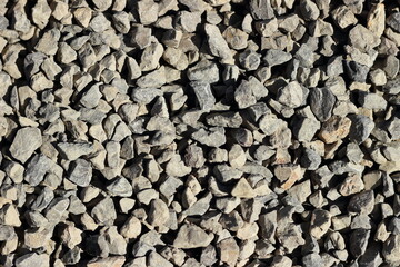 Stones in the sun's rays as background, texture.