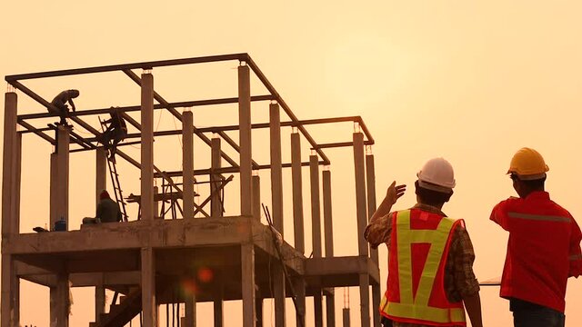 The foreman is inspecting the construction site.
