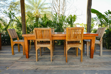 A set of wooden tables and chairs on the wooden patio in the restaurant,Asian style