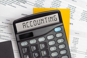 On display of calculator is written accounting