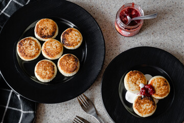 cheesecakes with strawberry jam on a plate
