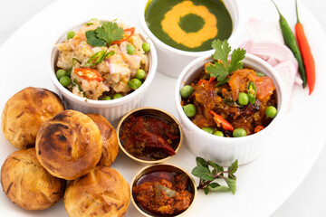Regional Food Of Bihar Jharkhand And Uttar Pradesh UP. Litti Chokha Litty Stuffed With Chana Sattu Served With Alu Or Aloo Baingan Bharta Desi Ghee Lehsun Adrakh Lehsoon Chutney Achar And Pyaj Salad