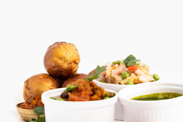 Litti Chokha Or Liti Choka From Bihar Jharkhand And Uttar Pradesh UP Is Stuffed With Chana Sattu. Served With Alu Or Aloo Baingan Bharta Desi Ghee Lehsun Adrakh Lehsoon Chutney Achar Mirchi And Pyaj