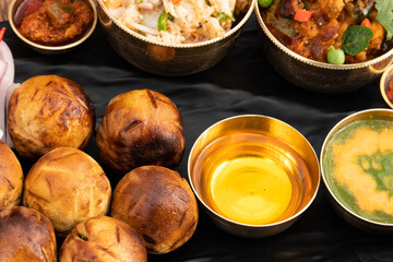Regional Food Of Bihar Jharkhand And Uttar Pradesh UP. Litti Chokha Litty Stuffed With Chana Sattu Served With Alu Or Aloo Baingan Bharta Desi Ghee Lehsun Adrakh Lehsoon Chutney Achar And Pyaj Salad