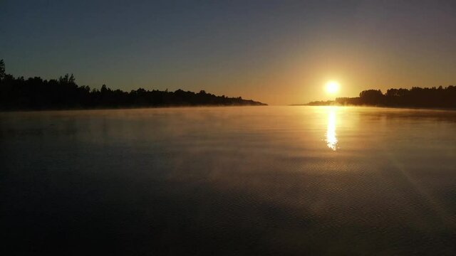 Aerial shot of beautiful foggy sunrise in Amazon river in South America