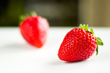 Strawberry on the white background, raw real strawberry
