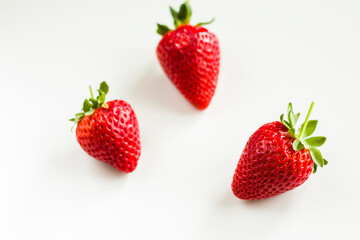 Strawberries on the white background, raw real strawberry