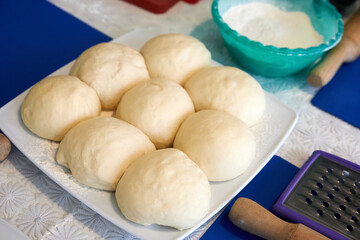 Dough balls prepared for making pizza. Close-up, selective focus
