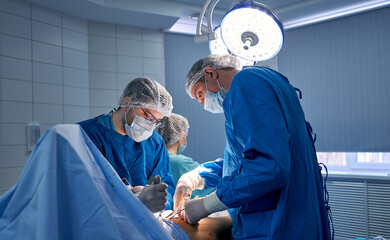 doctors work hard in the operating room