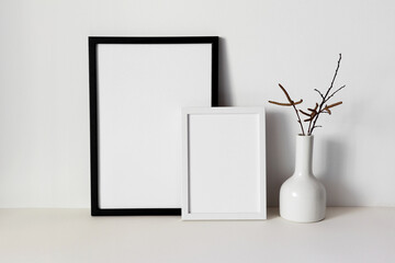 Black and white photo frame mockup with white vase