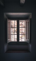 A dark vintage window inside a room