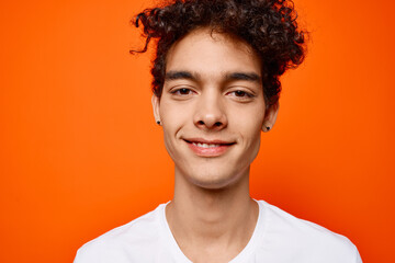 guy in white t-shirt curly hair cropped view studio