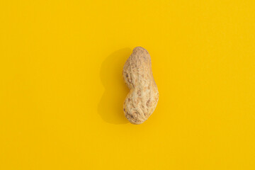 peanuts in a shell with a hard shadow