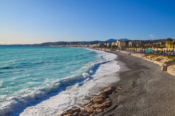 An empty beach in Nice, South of France during winter, closed to the public due to strong waves.
