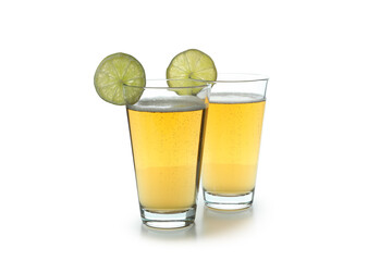 Glasses of ginger beer isolated on white