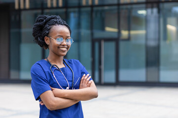 portrait young  black lady doctor with stethoscope with glasses, trendy african american woman with dreadlocks in uniform, smiling afro girl medical student  at college, university, hospital, clinic