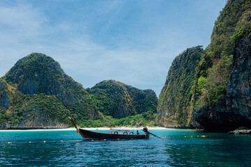 Fototapeta na wymiar Krabi Thailand. March 23, 2021 Long boat and blue water at Maya bay in Phi Phi Island