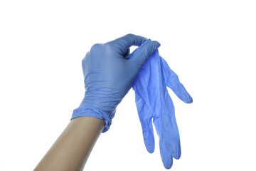 Hand in medical glove holds glove, isolated on white background