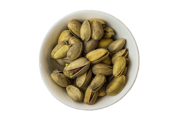 Pistachios in a white bowl on a white background