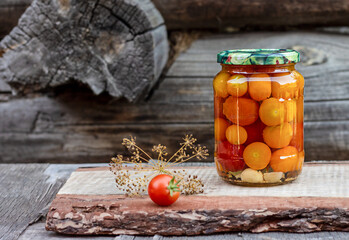 Tomatoes in a glass jar, homemade pickles