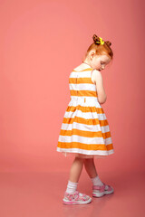 A little girl with red hair was offended and turned away.