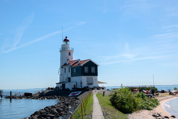 Fototapeta na wymiar The Lighthouse Paard Van Marken At Marken The Netherlands 6-8-2020