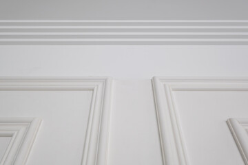 Detail of corner ceiling with intricate crown molding.