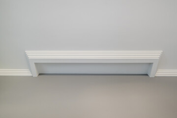 Detail of corner ceiling with intricate crown molding.