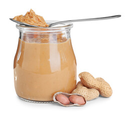 Glass jar and spoon with tasty peanut butter on white background
