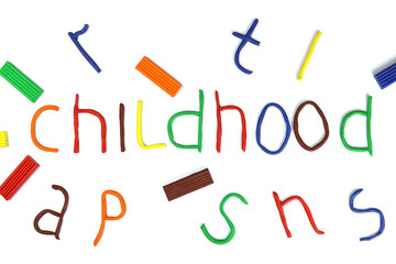 word childhood made of colored plasticine isolated on white