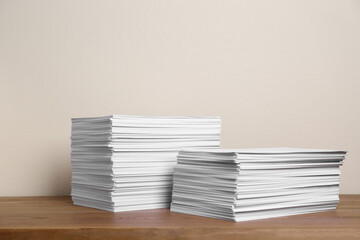 Stacks of paper sheets on wooden table