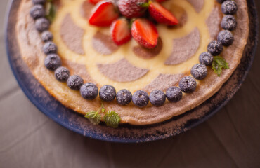 Cottage cheese pie, decorated with berries.
