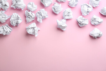 Crumpled sheets of paper on light pink background, flat lay. Space for text